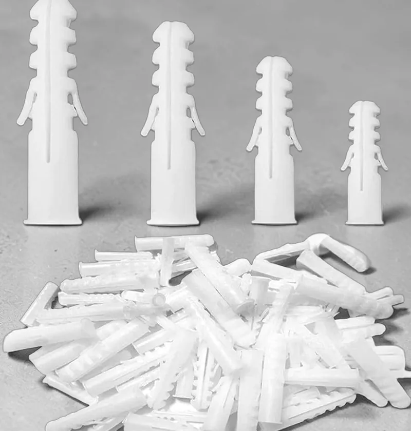 White PVC wall plugs of multiple sizes