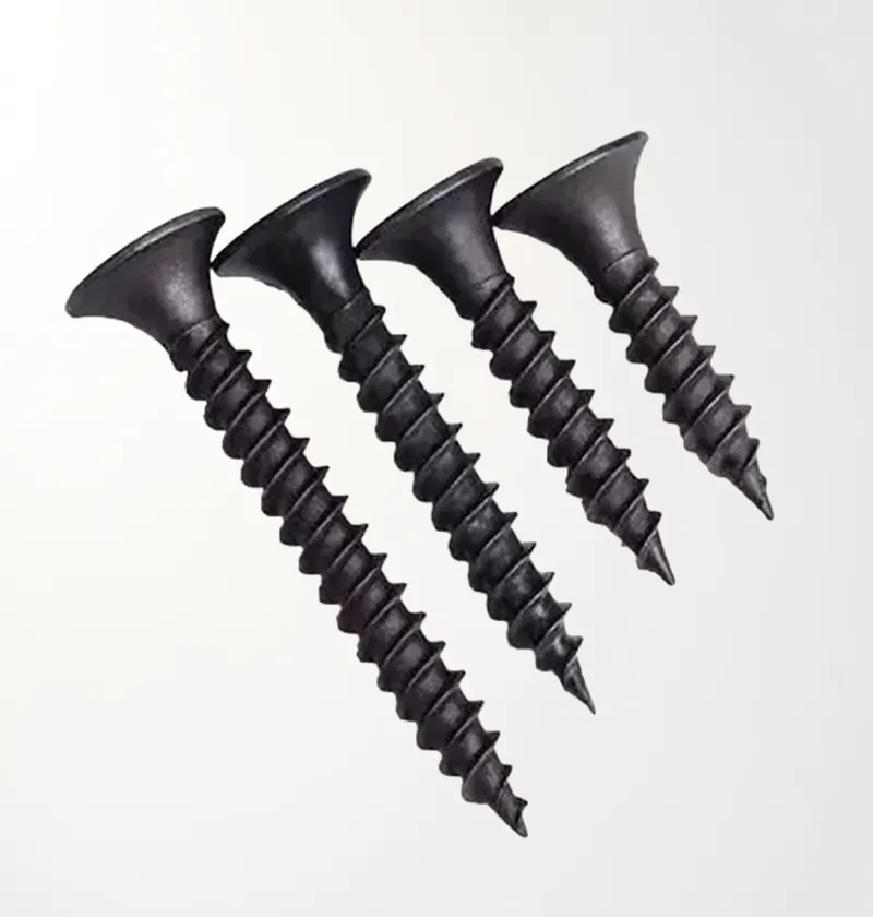 Four black drywall screws arranged diagonally